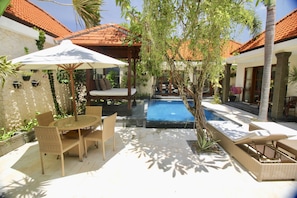 GARDEN AREA WITH POOL LOUNGES AND GAZEBO