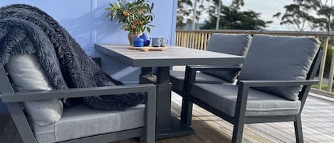 outside dining area in sheltered nook set back for privacy