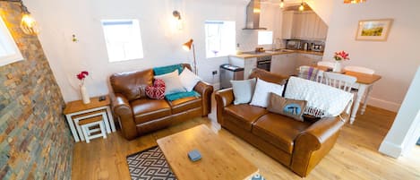 Beautiful open plan living area featuring a stunning welsh slate wall.