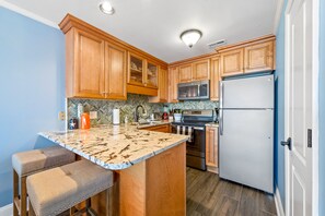 BREAKFAST BAR SEATS 2. VERY NICE FULLY STOCKED, UPDATED KITCHEN. 