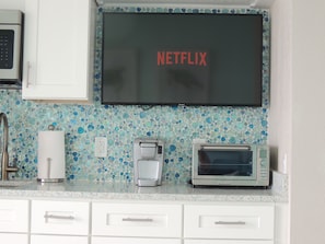 Smart TVs in the kitchen and bedroom