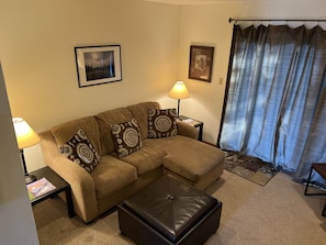 Comfy living room with convenient, modern electric fireplace.