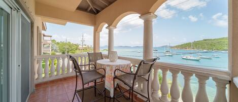 Outside front balcony over looking Cruz Bay with seating for four