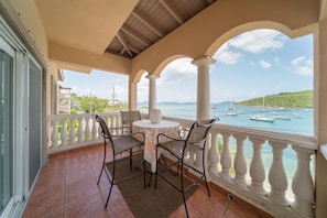 Outside front balcony over looking Cruz Bay with seating for four