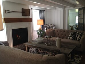 The living room with its fireplace for chilly Hudson Valley nights.