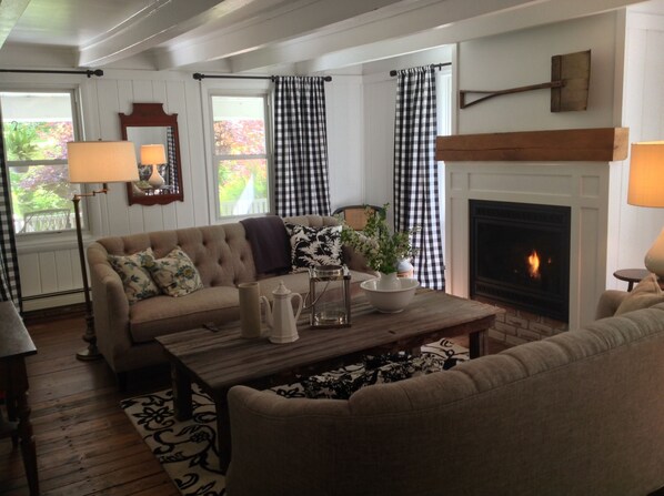The living room features a coffee table crafted from a beautiful barn door.