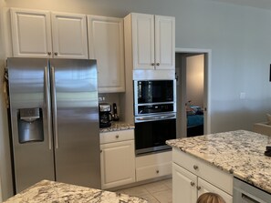 Remodeled kitchen granite, new stove microwave combo unit.