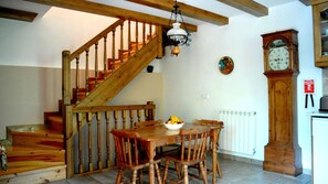 Casa Petirrojo Torla Dining area and staircase. (clock now removed).