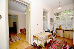 Large kitchen diner opening into a living room