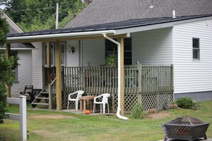New spring 2022 permanent deck roof, overlooks side lot.