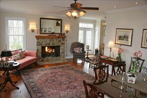 Living room/dining room from stairway landing.  French doors to stone patio.