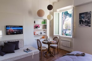 Sofa (bed) to relax and admire the Dome, wood flooring