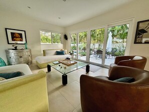 … lead out to the patio , pool and gardens
