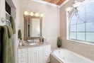 West Master Bedroom's adjoining bath with Jacuzzi tub and large shower