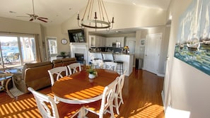 Vaulted ceilings. Dining room table seats six with additional seating in kitchen
