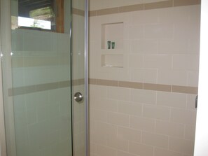 Tiled shower in downstairs bathroom.  
