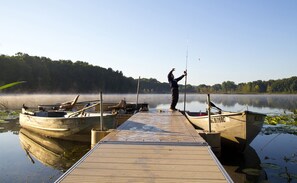 The fishing pier with three row boats