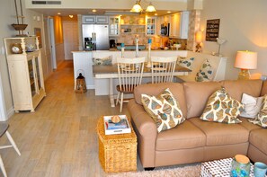 Overall view of Living, Dining, and Kitchen, all with beach view.