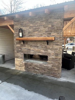 Double sided fireplace on the brand new porch addition. 