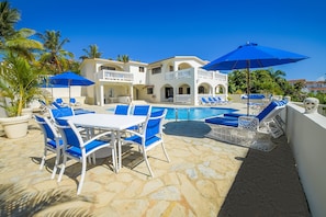 A large open sun terrace has walls on all sides