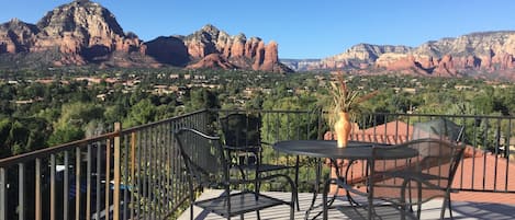 View from the balcony.
Outdoor space surrounded by red rocks.