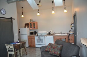 View from front door-LR, dining, kitchen with skylights