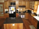Large kitchen with granite countertops