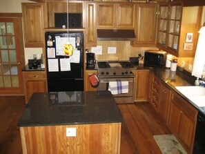 Large kitchen with granite countertops