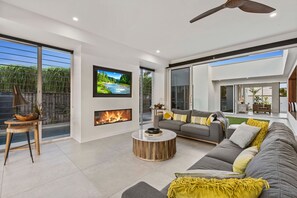 Downstairs Living Room with views to pool and courtyard. 