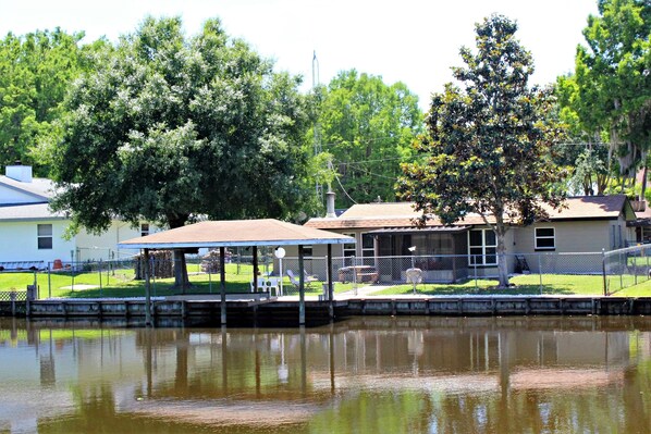 We are located at the end of the canal ~ we have a fenced yard and sea wall.