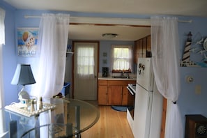 View into Kitchen (glass high top table has been replaced with kitchen table