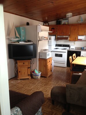 View from the front door. What's behind TV & microwave...?