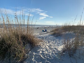 A short walk or bike away, the dunes and beach call to you...