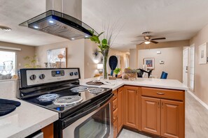 Stainless steel appliances and marble countertops make the kitchen feel state of the art.