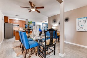 Touches of blue bring the dining area to life. It's perfect for "at home" 