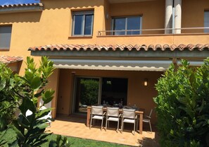 Terrace with table and sun screen