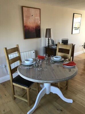 Dining area catching the morning sun. Overlooks the garden and busy bird table!