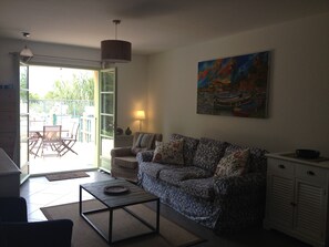 Living room, leading to garden, terrace and pool