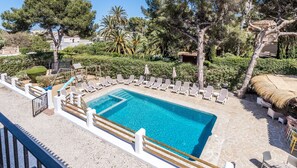 The pool, bubbling spa, bar/relaxed seating and children's play area. 