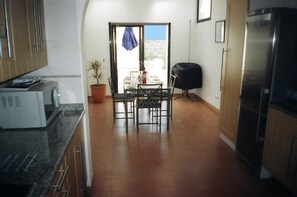 Spacious self contained open plan kitchen dining area patio doors to BBQ terrace