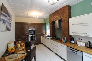 Spacious well equipped kitchen, with double oven