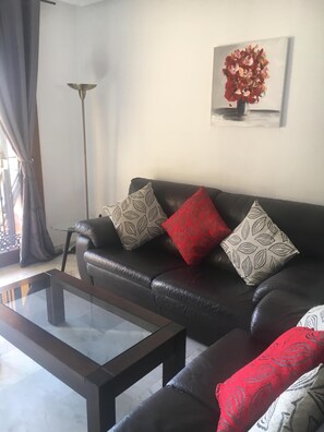 Leather sofas with new soft furnishings