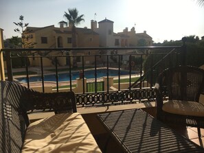 Relax on the terrace whilst overlooking the pool. 