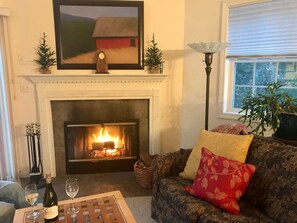 Cozy wood burning fireplace. And that's Grandma's antique standing lamp!