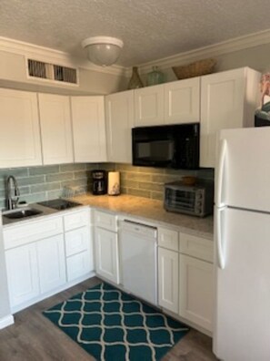 Newly renovated kitchen stocked with the essentials for a meal in