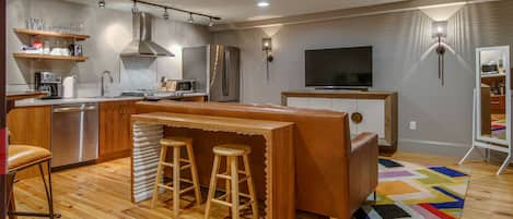 Kitchen and living room with pub table