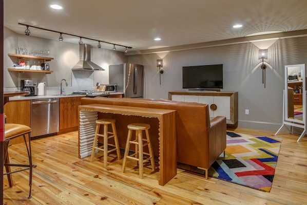 Kitchen and living room with pub table