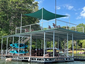 Double-decker dock with Polywood furniture and 2 kayaks