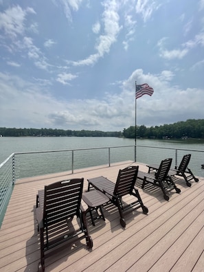 4 recliners and side tables on the top deck provide excellent views and sunning