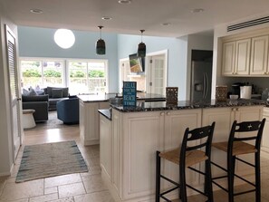 Open Kitchen & many places to eat including dining table